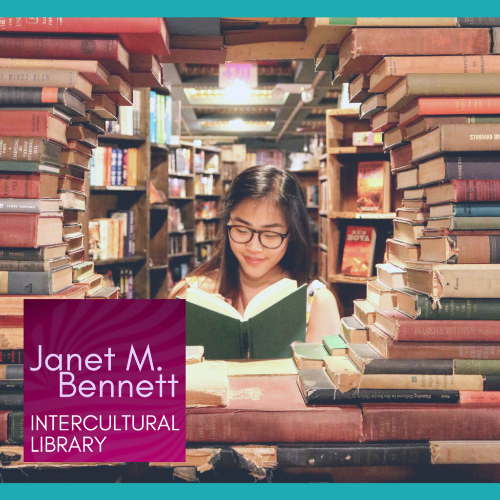 Woman in Library surrounded by materials